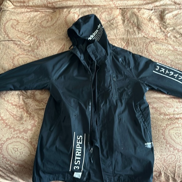 This is a one of a kind adidas trench coat. Very good condition.
